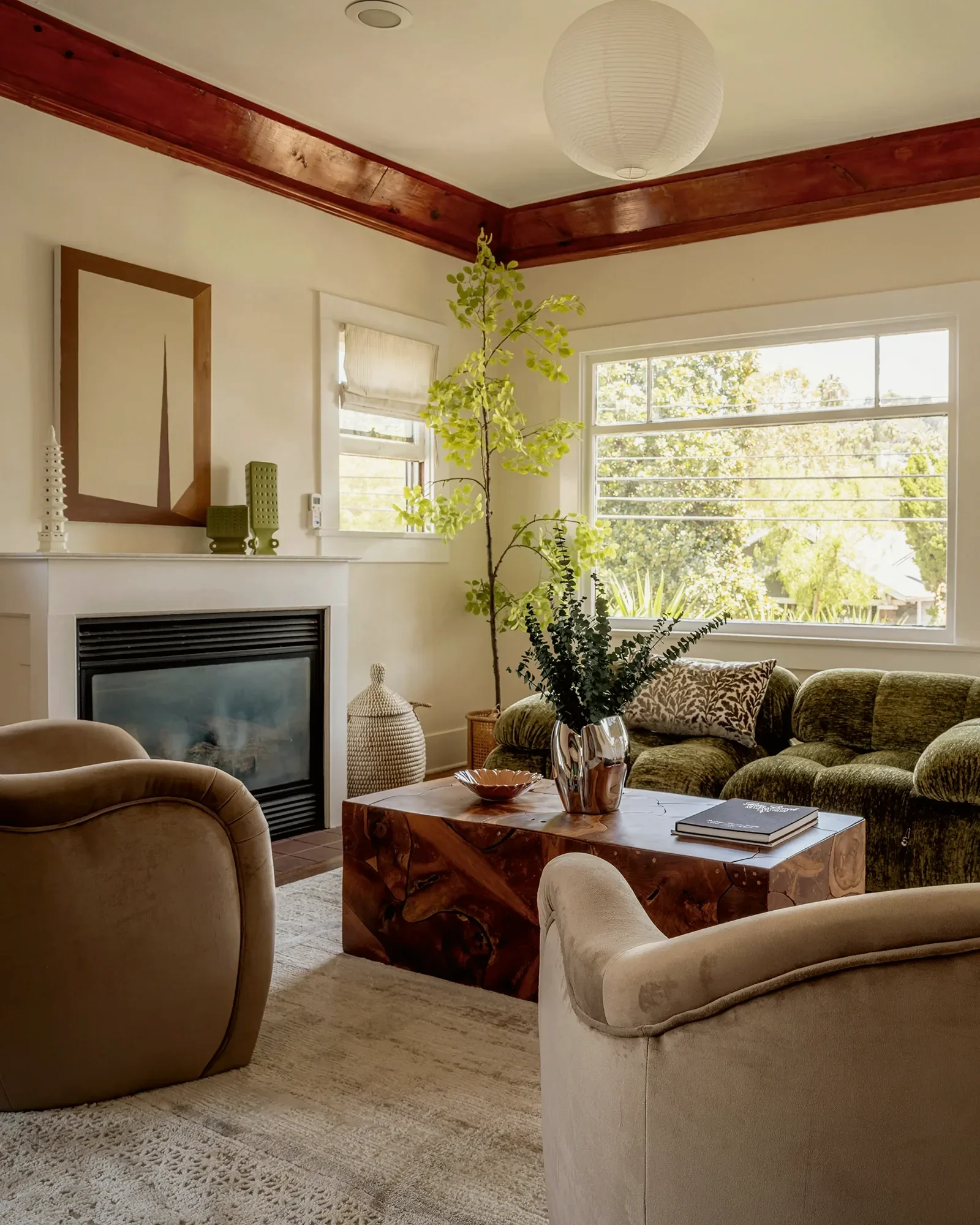 Los Feliz Oaks living room with original timbered ceiling trim, light upholstery and a hillside view, staged by Nesting Dolls Design
