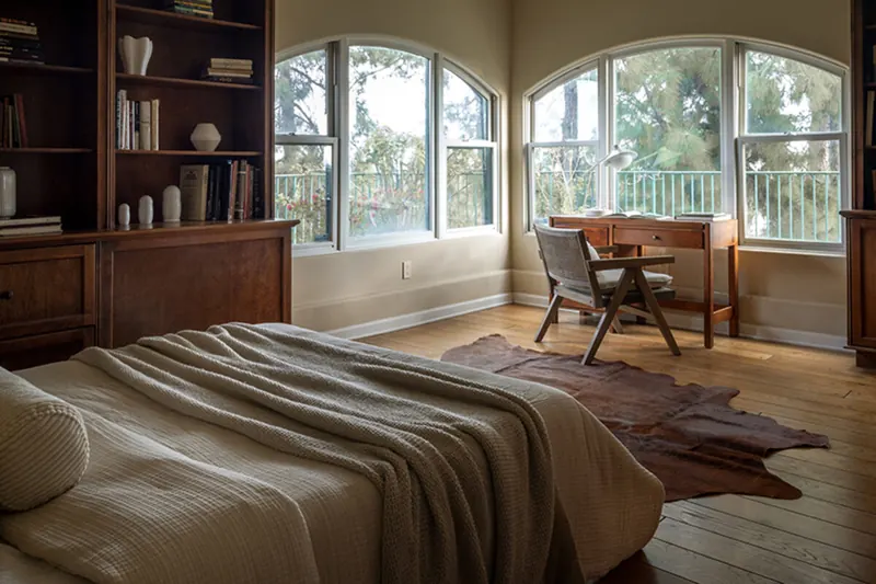 Beverly Hills interior layered with texture and warm wood, staged by Nesting Dolls Design