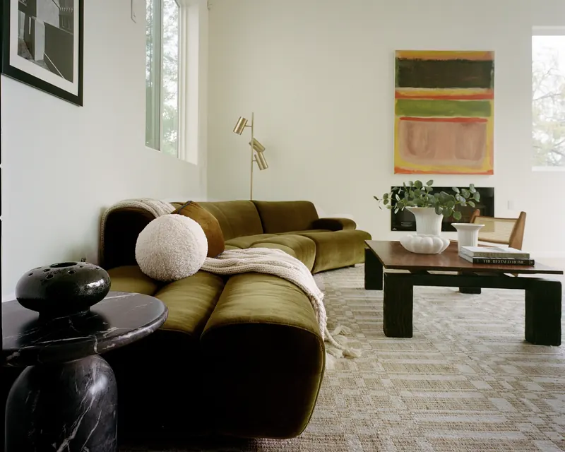 Silver Lake living room staged with an olive velvet sectional and low walnut coffee table by Nesting Dolls Design